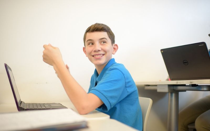 student smiling in classroom